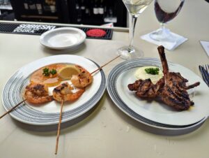 Shrimp & Scallop skewers and a plate of Grilled Lamb Chops at Martin's in Key West. These are 50% off during happy hour.