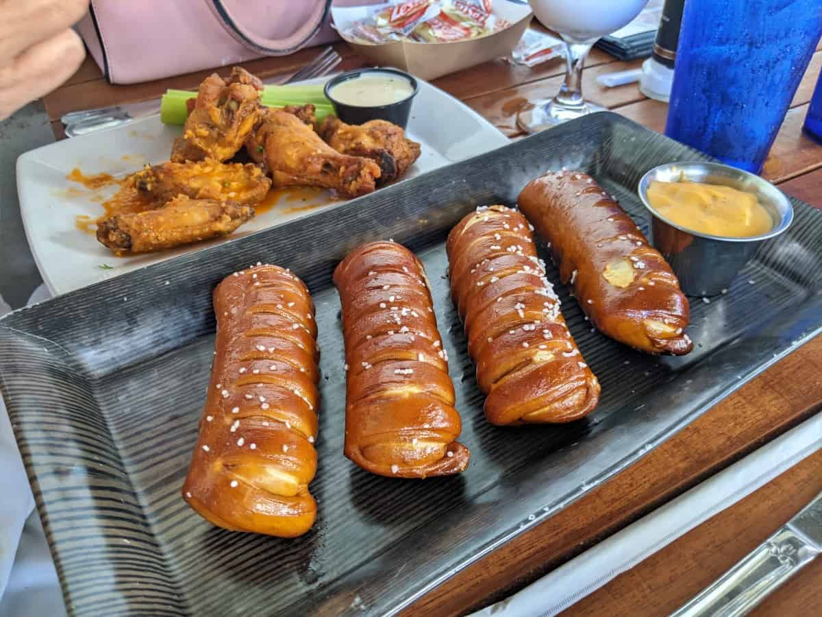 soft pretzels with beer cheese dip and a plate of chicken wings at Alonzo's Key West