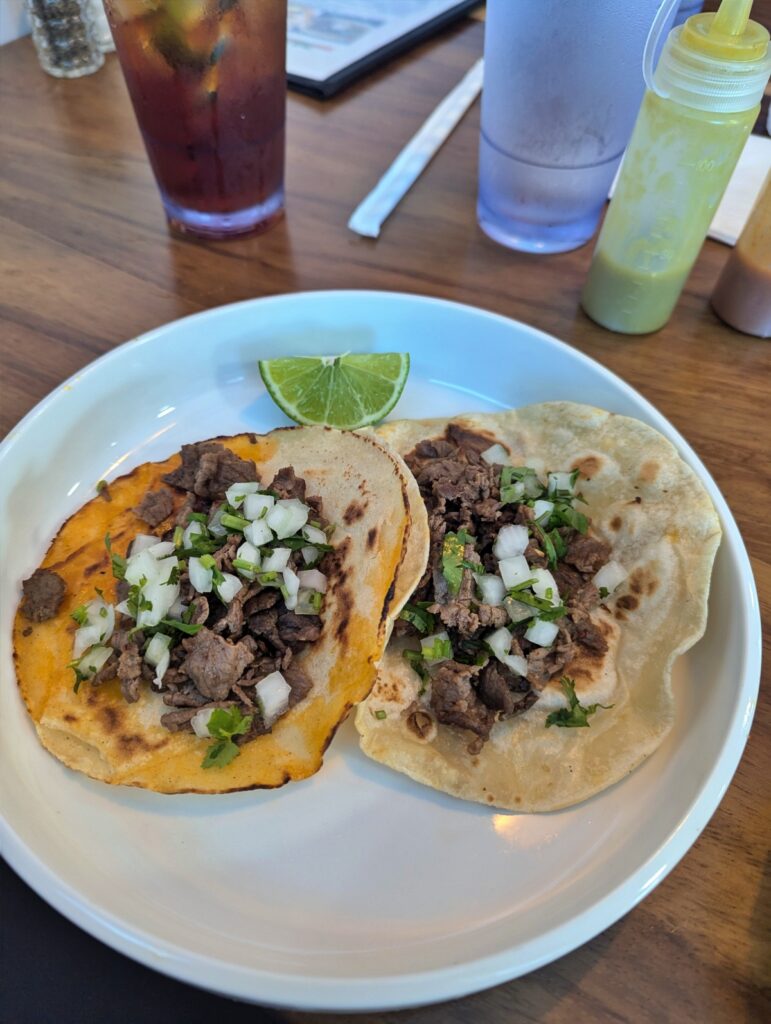 Two tacos. One corn tortilla and one flour.