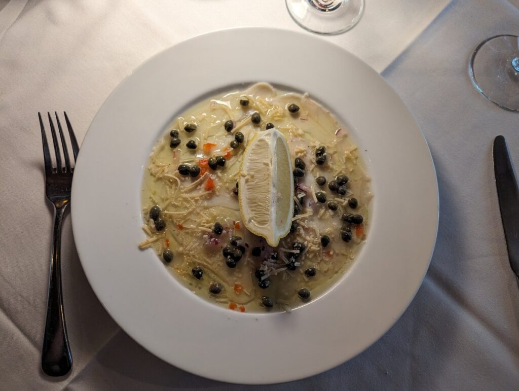 Conch carpaccio with capers and lemon at Cafe Sole in Key West
