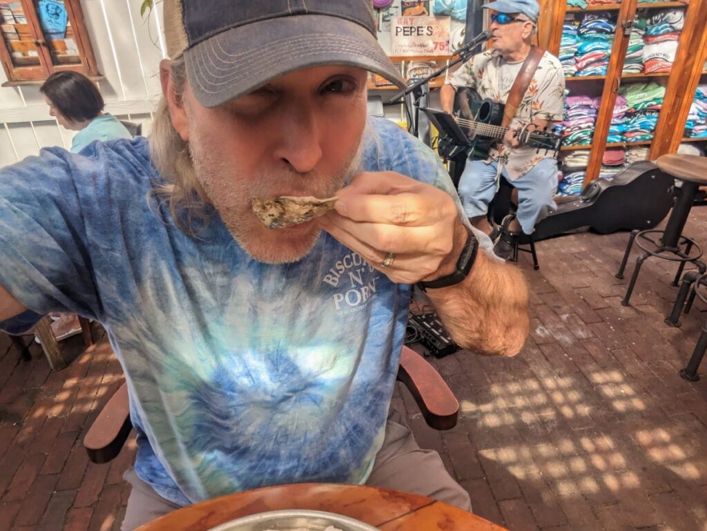 Author eating a raw oyster at Pepe's Cafe, Key West