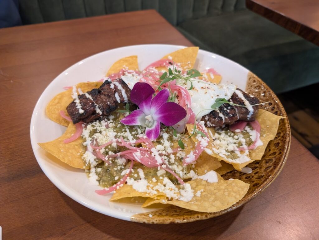 Skirt steak chilaquiles with salsa verde, queso fresco, and a fried egg