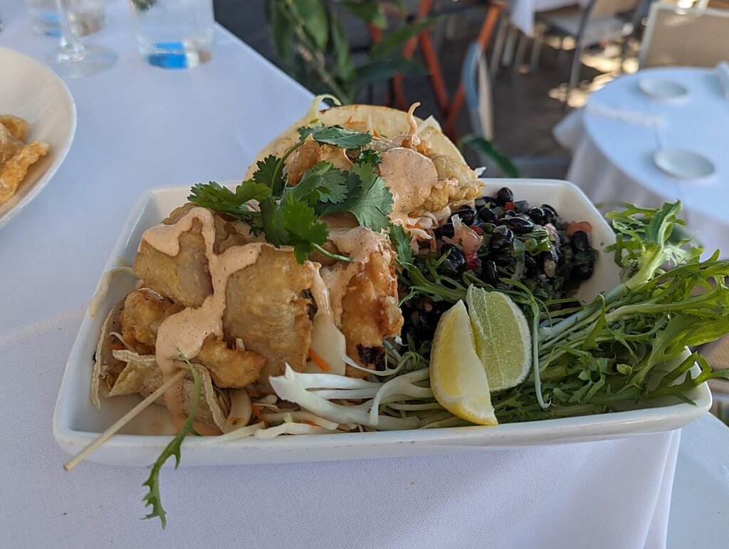 Fried fish tacos with black bean salad at Louie's Backyard